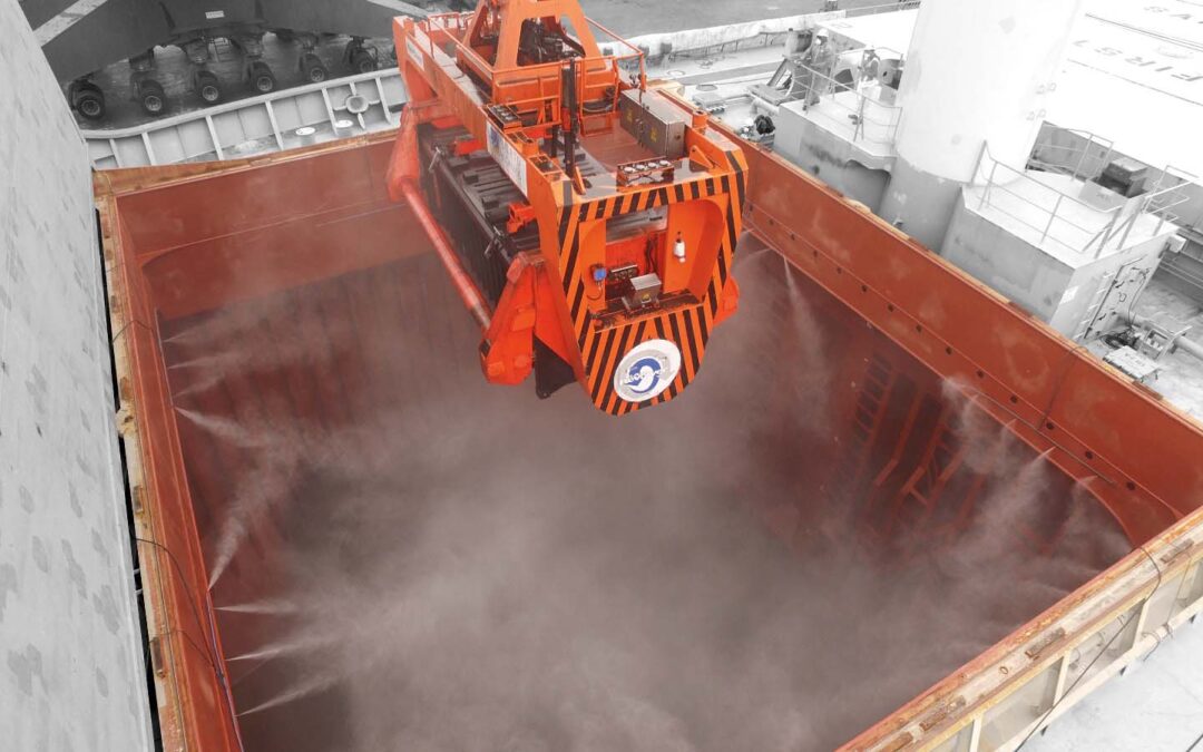 mist suppression system for reducing dust when unloading bulk materials